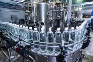 a line of water bottles in production